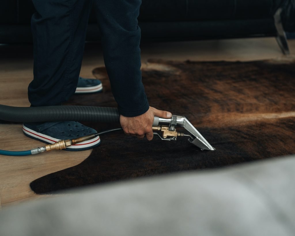 vacuuming the carpet