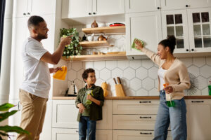 Together a loving family cleans the kitchen and enjoys quality time at home | House Cleaning Rapid City South Dakota