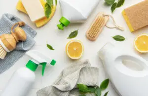 Eco friendly cleaning products promoting sustainable lifestyle with lemons and brushes